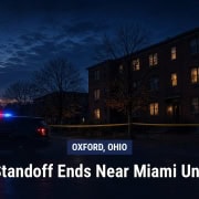 Illustration of a police vehicle outside an apartment building at dawn in Oxford, Ohio